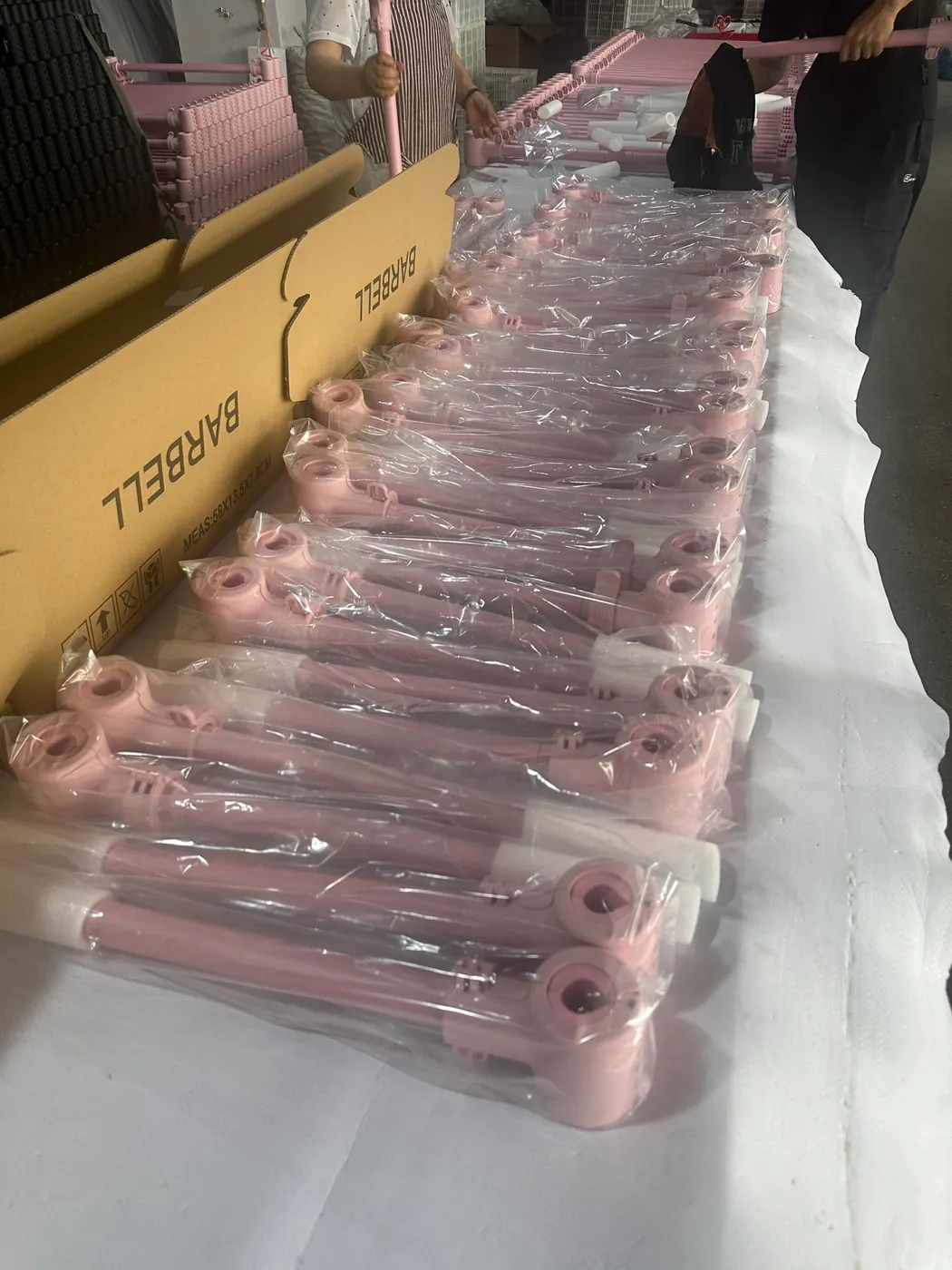Pink barbell products being packed